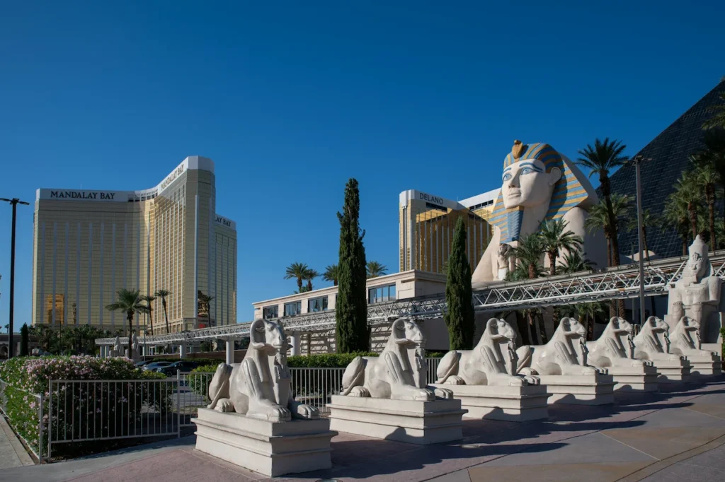 The Great Sphinx replica in front of the Luxor pyramid with Mandalay Bay visible behind it