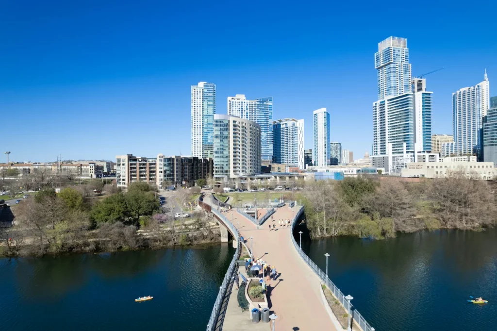 Austin skyline and a pedestrian bridge over Lady Bird Lake