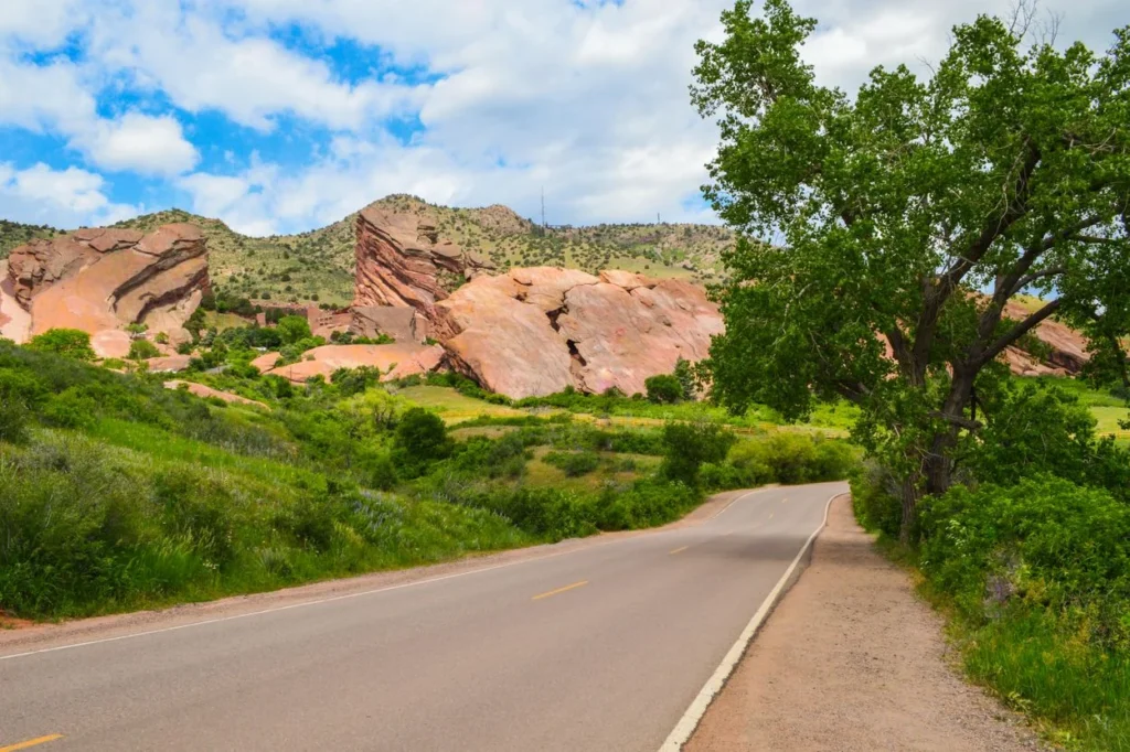 Road approaching the famous red rock formations at Red Rocks Park near Denver