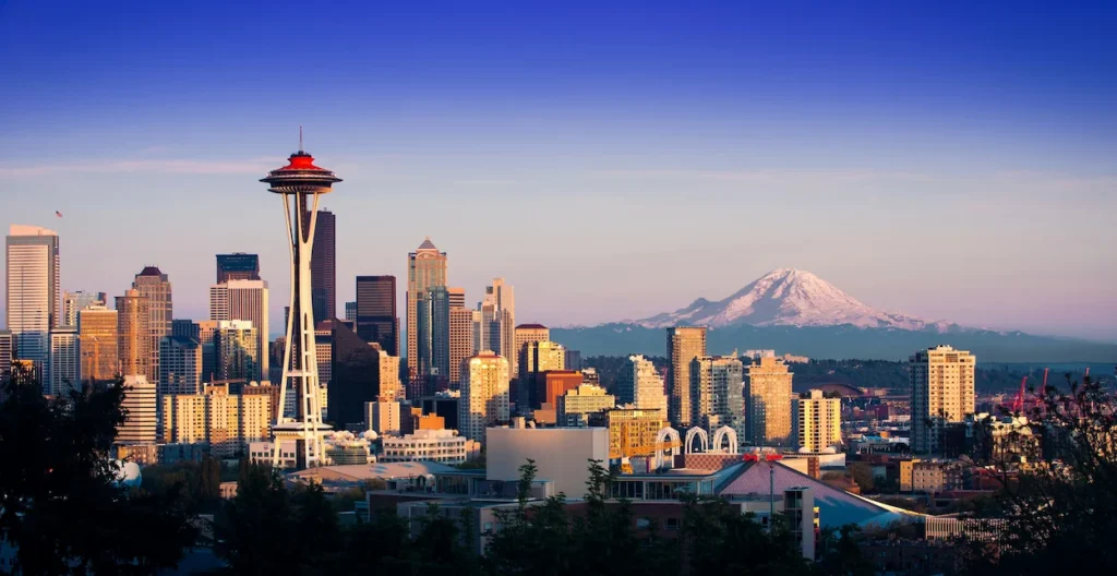 Seattle skyline with the Space Needle and Mount Rainier under a blue sky