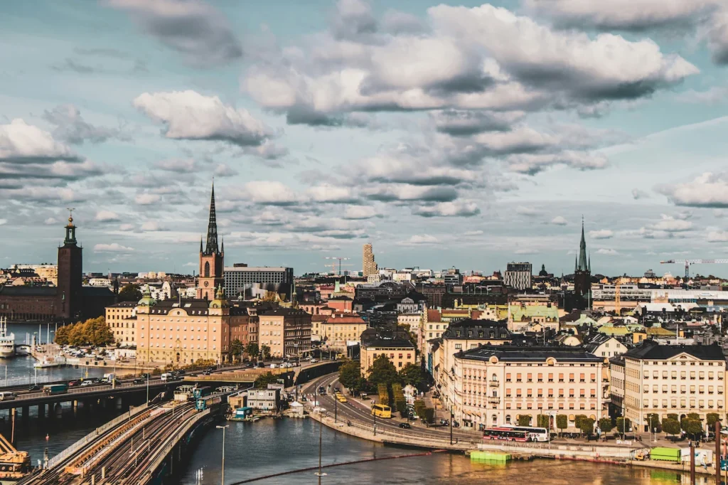 High-angle view of the Stockholm skyline, Riddarholmen Church, and city waterways