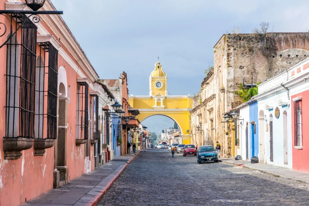 Santa Catalina Arch spanning across a cobblestone street in Antigua, Guatemala