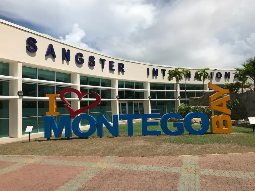 Sangster International Airport terminal exterior with an I Love Montego Bay sign