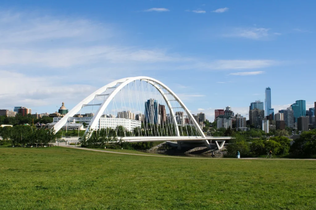 Walterdale Bridge over a river with the Edmonton skyline in the background