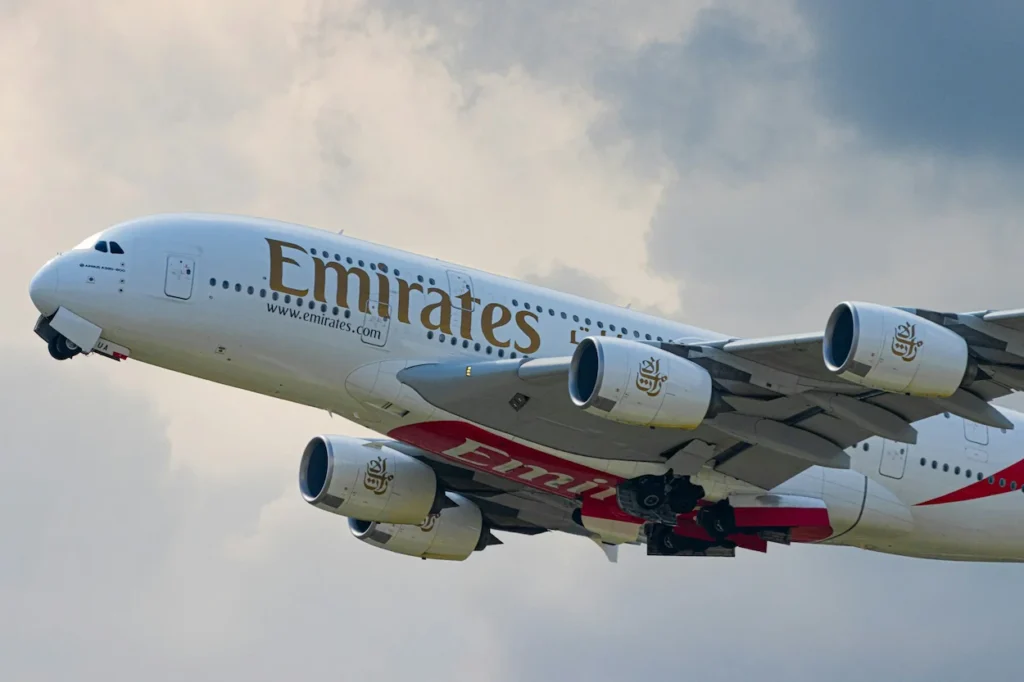 Emirates Airbus A380 double-decker airplane ascending into the sky