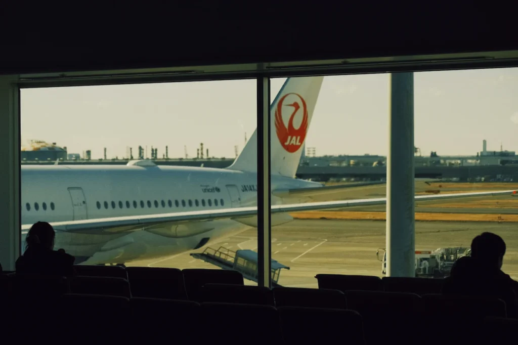 Japan Airlines Airbus A350 parked at a terminal with passengers inside