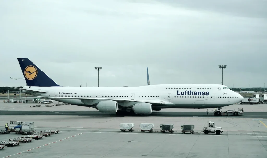 A Lufthansa Boeing 747-8 commercial passenger jumbo jet taxiing on the airport runway