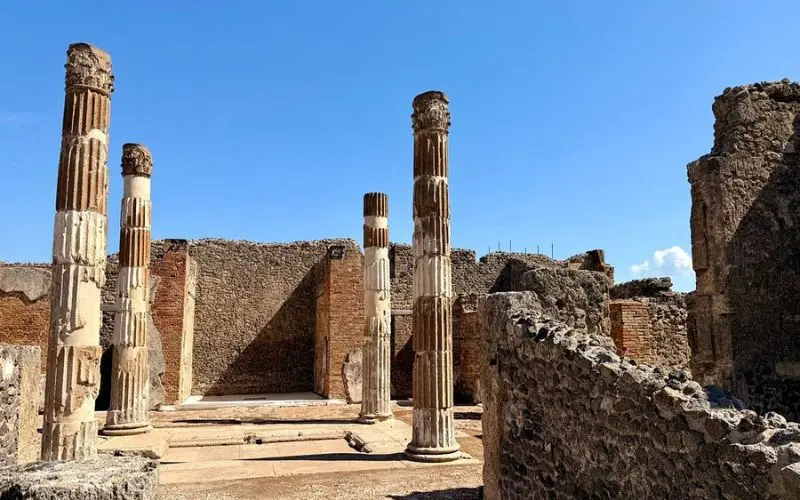 Ancient stone columns and ruins in Pompeii, Italy.