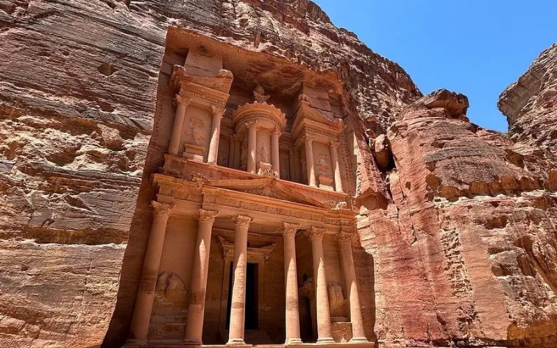 The carved sandstone facade of Petra in Jordan.