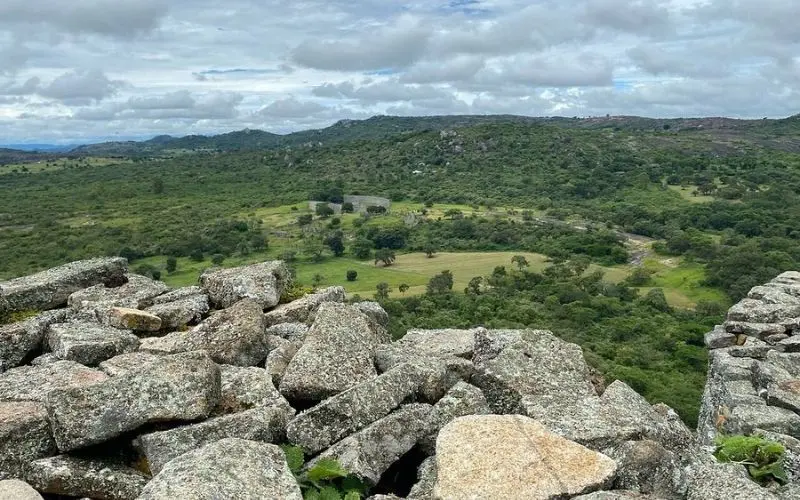 Stone ruins overlooking fields at Great Zimbabwe in Zimbabwe.