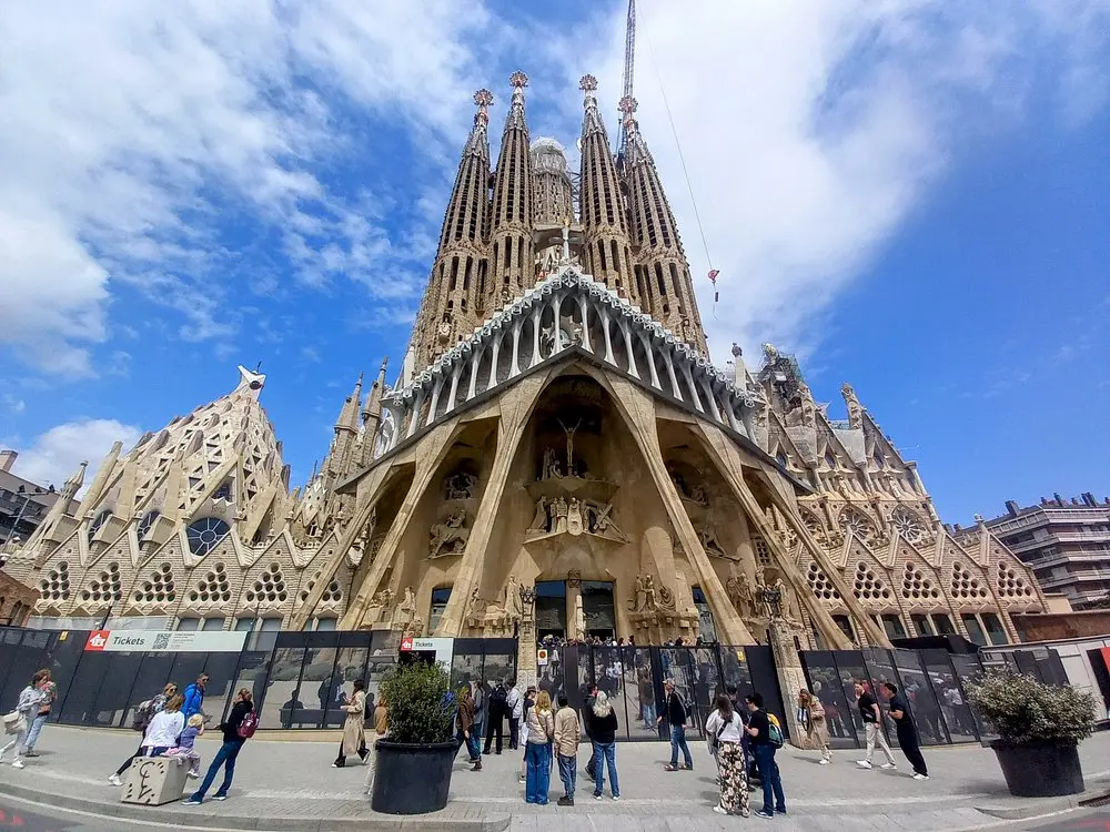 The towering spires and detailed facade of the Sagrada Familia in Barcelona.