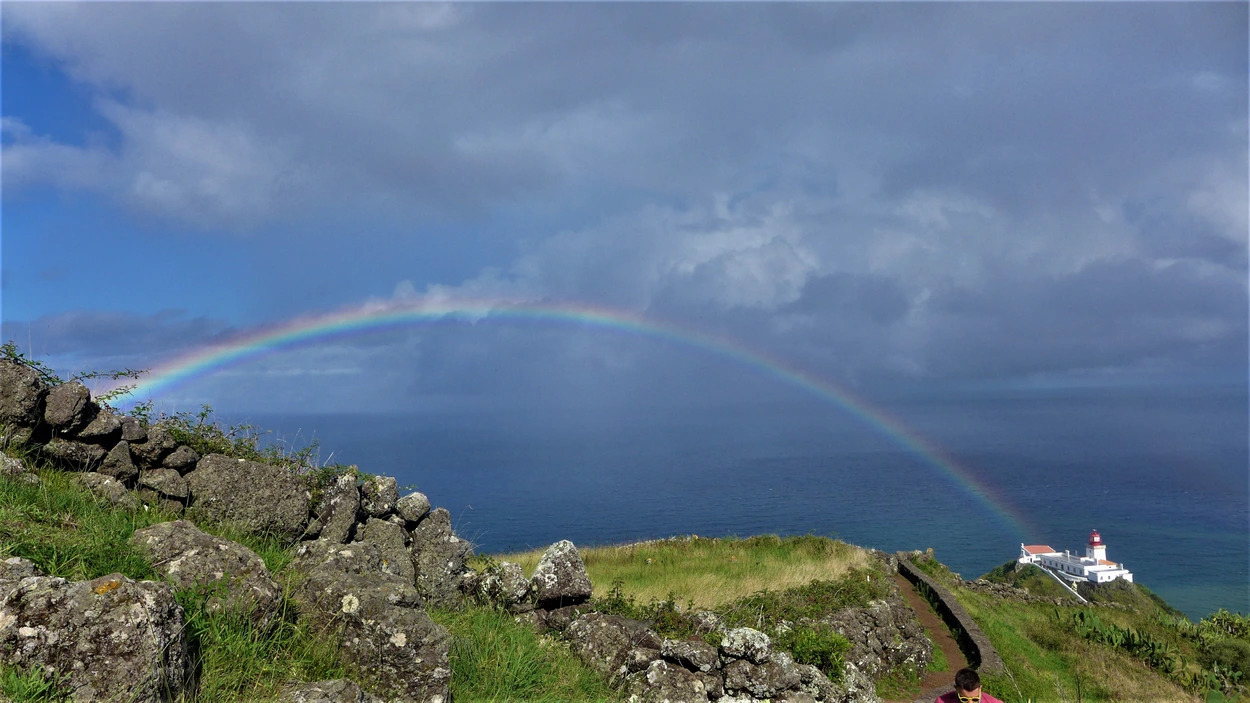 Rainbow over lighthouse on the coast of Santa Maria Island in the Azores