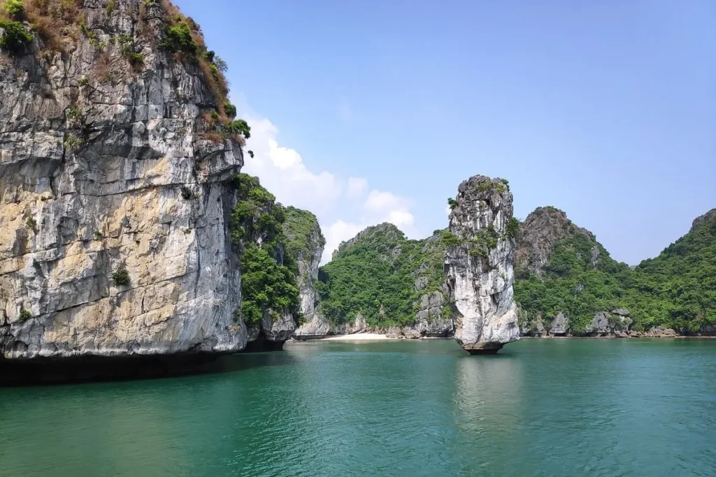 Limestone cliffs rise from emerald waters in the scenic Ha Long Bay, Vietnam.