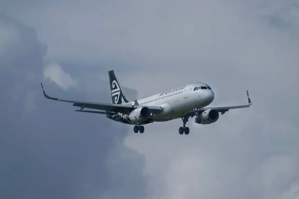 Air New Zealand Airbus A320neo on final approach under a cloudy sky