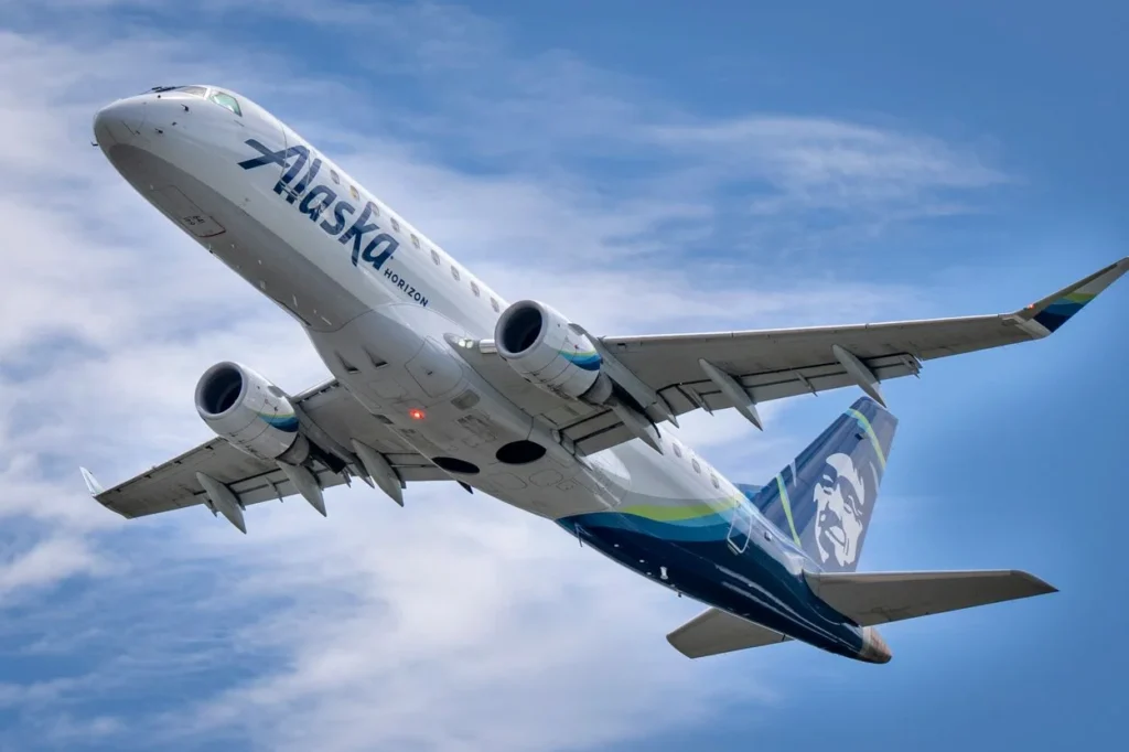Underbelly view of an Alaska Airlines Embraer E175 regional jet