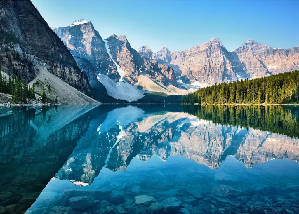 Clear turquoise Moraine Lake reflecting the Valley of the Ten Peaks in Banff National Park
