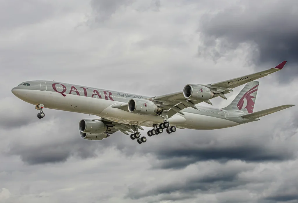A Qatar Airways Airbus A330-300 widebody passenger airplane descending on final landing approach