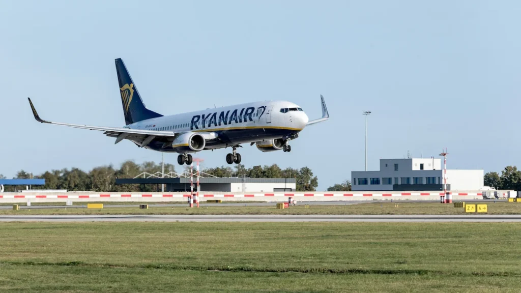 Ryanair Boeing 737-800 passenger jetliner approaching the runway with its landing gear deployed