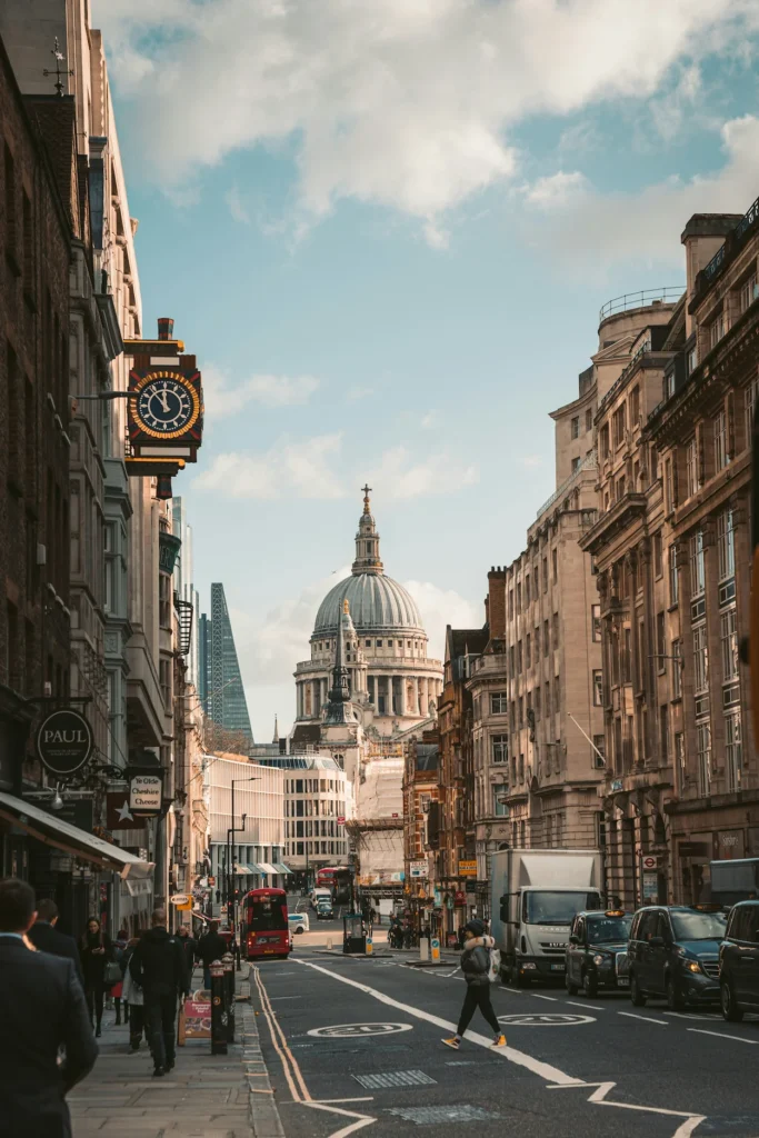 St Paul's Cathedral dome framed by buildings on Fleet Street in London