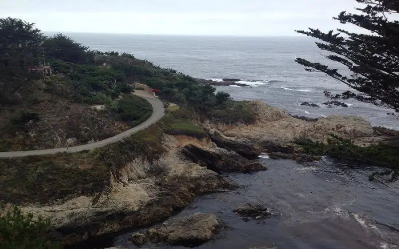 Winding road along the rocky coastline at Old Coast Road.