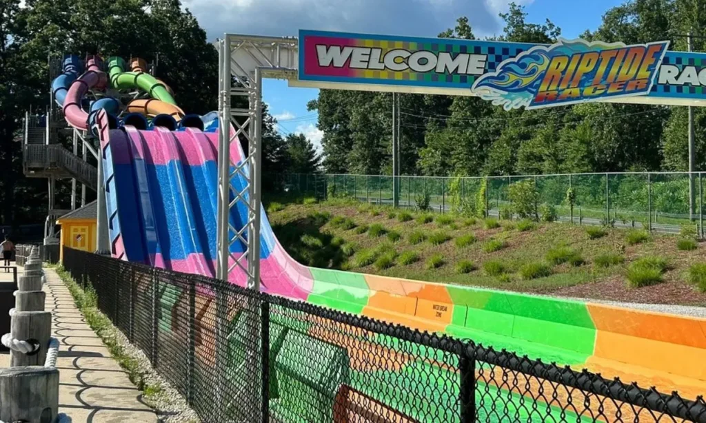 Colorful multi-lane water slides at Lake Compounce on a sunny day.