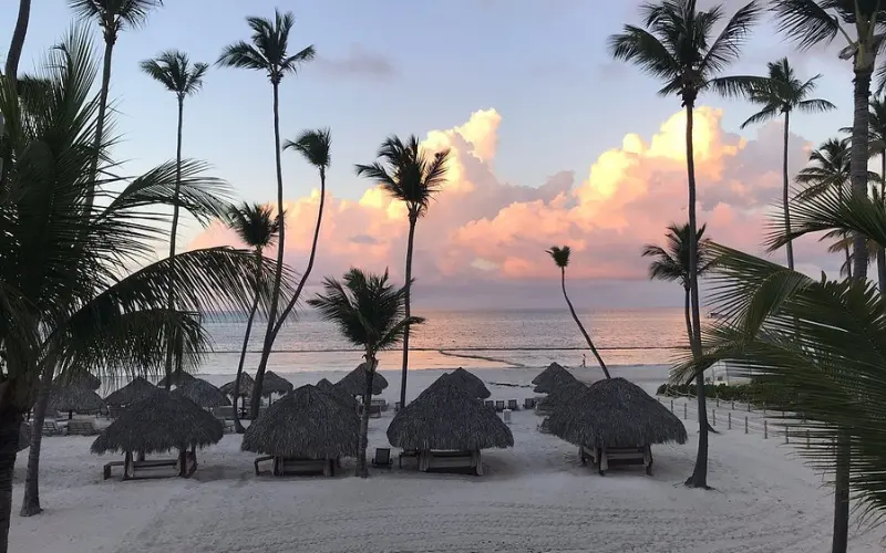 Beachfront with thatched cabanas at The Reserve at Paradisus Palma Real in the Dominican Republic.