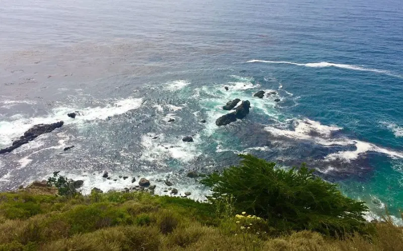 Rocky shoreline with waves at Pfeiffer Big Sur State Park.