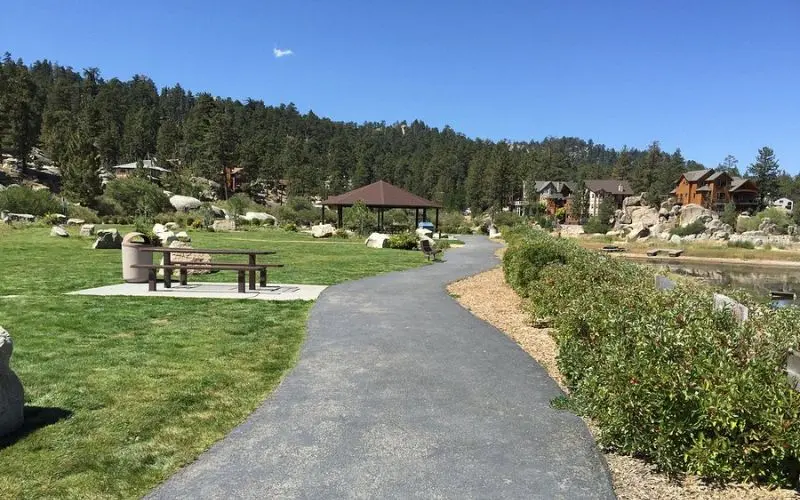 A walking path and picnic area sit by the water at Boulder Bay Park.