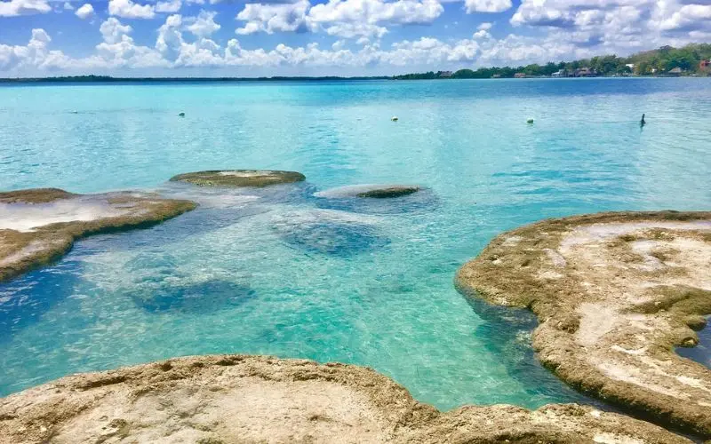 Clear blue water sparkles in the lake at Bacalar.