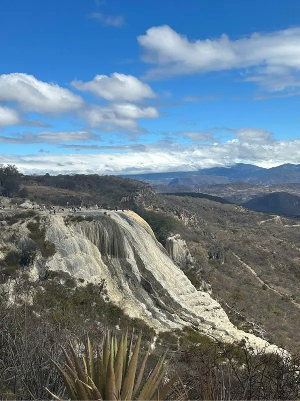 Mineral formations resembling frozen waterfalls cover the cliffs at Hierve el Agua.