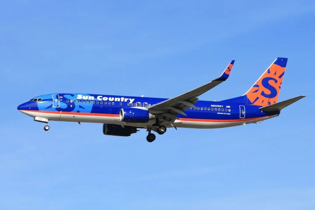 A Sun Country Airlines Boeing 737-800 passenger airplane flying on final approach to land