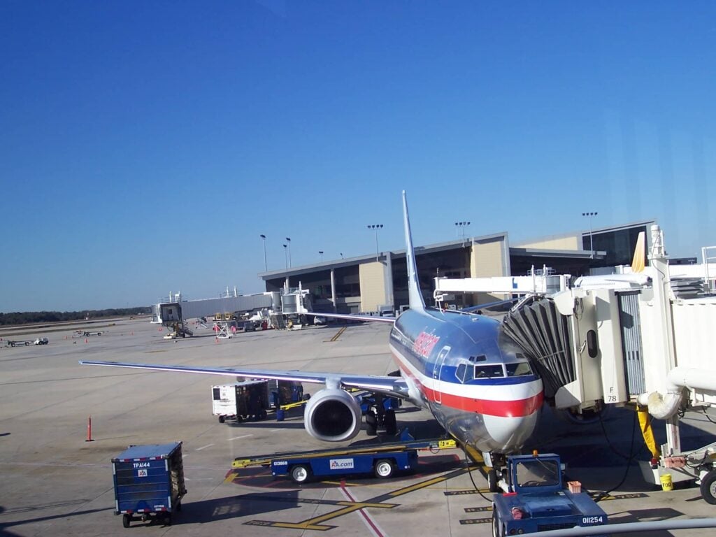 A passenger jet docking at Tampa International