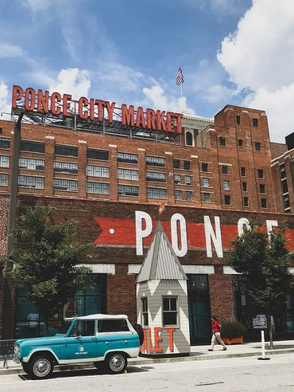 The brick building of Ponce City Market stands under a blue sky.
