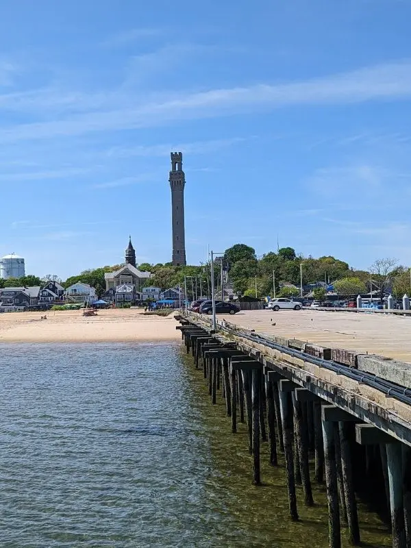 View of Pilgrim Monument rising above the town and beach from the pier.