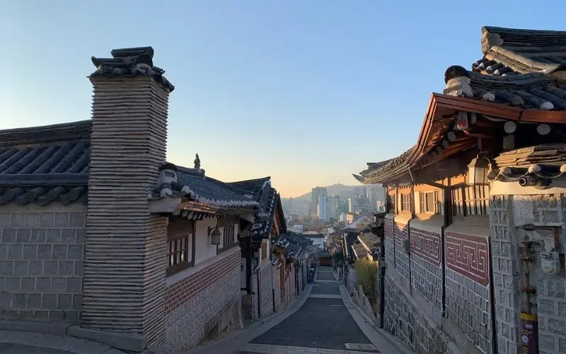 Traditional hanok houses along a narrow street in Seoul.