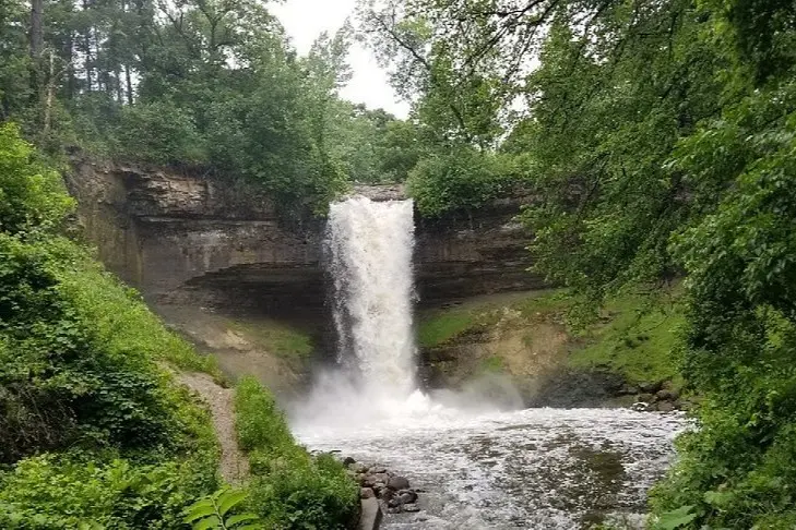 A waterfall cascading into a pool at Minnehaha Falls in Minneapolis.