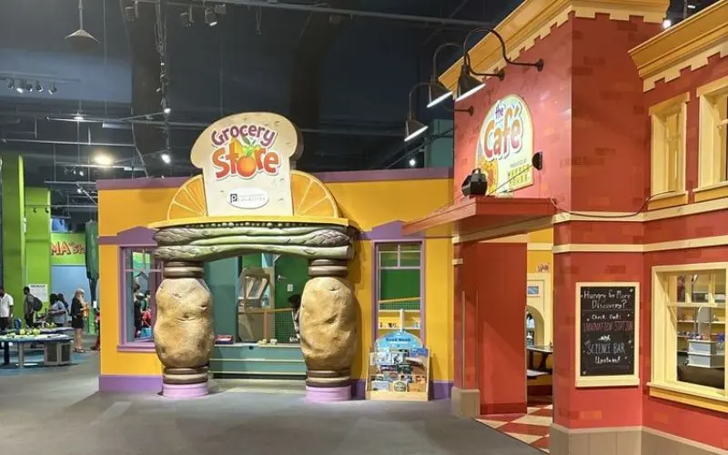 Colorful play area with a pretend grocery store at the Children’s Museum of Atlanta.