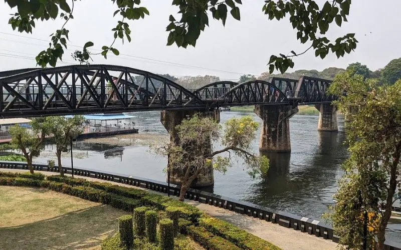 The black steel bridge crosses the River Kwai in Kanchanaburi.