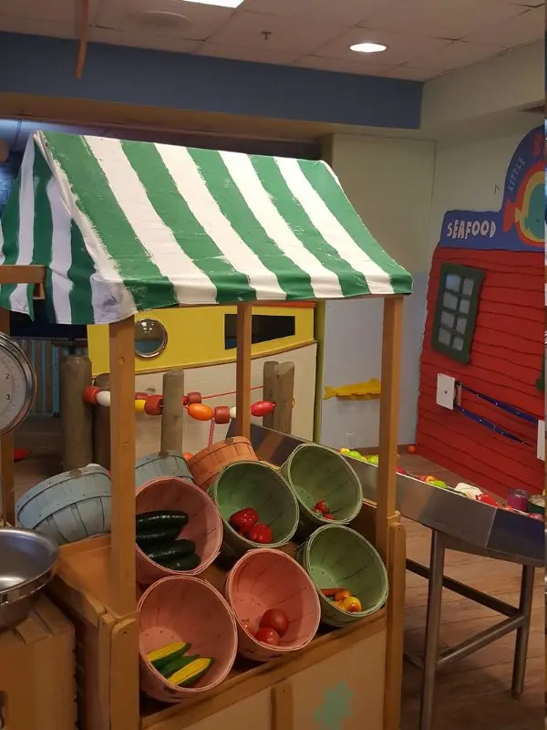 Play market setup with toy produce at Portland Children’s Museum.