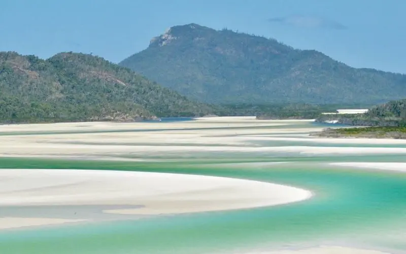 Swirling white sand and turquoise water at Whitsunday Islands.