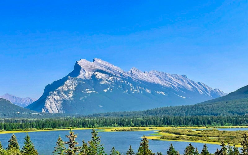 Lake Louise is a serene majesty where turquoise waters mirror towering mountain grandeur.