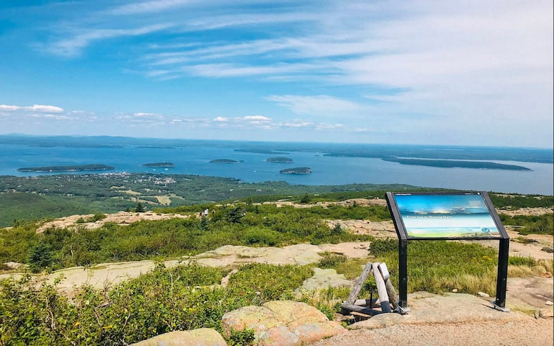 Cadillac Mountain is a peak tranquility where the sunrise paints the sky above endless horizons.