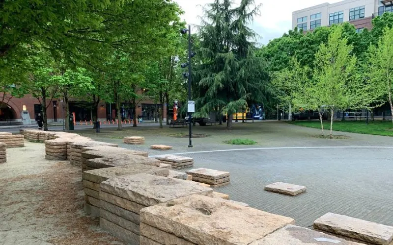 Open plaza with fountains and trees at Jamison Square.