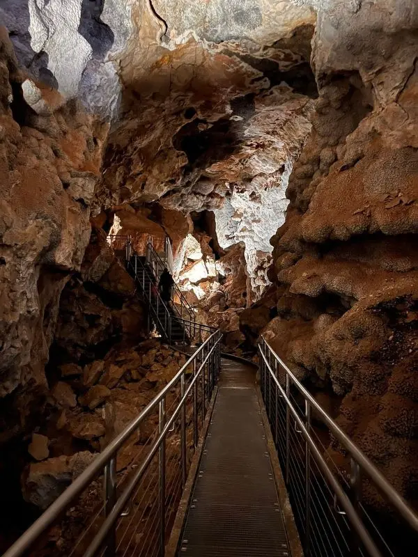 A walkway leads through the rocky caverns of Jewel Cave National Monument.