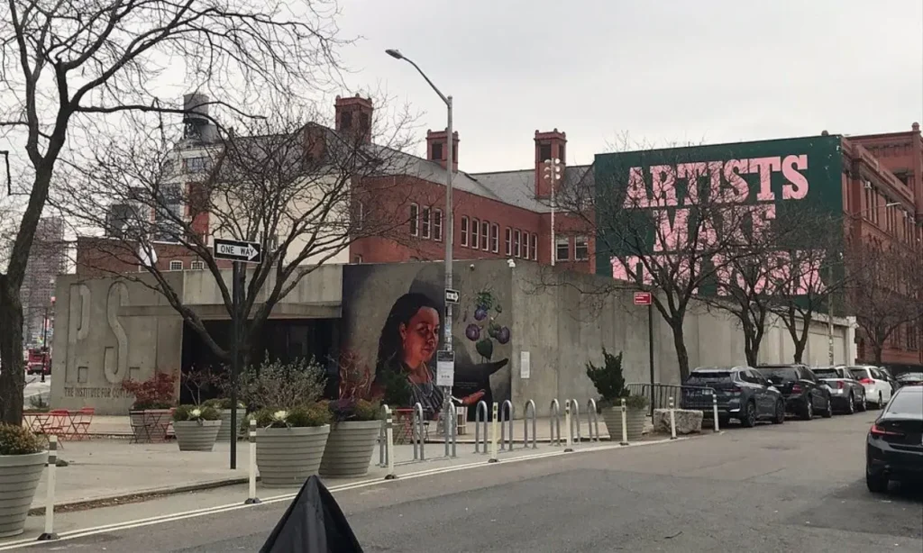 The exterior of MoMA PS1 features murals and bold text reading “Artists Make New York.”