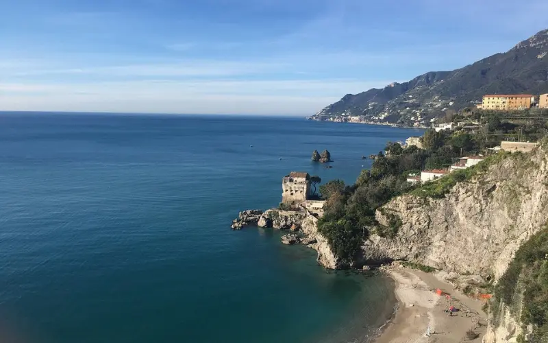 Coastal view of Vietri sul Mare with an old watchtower by the sea.