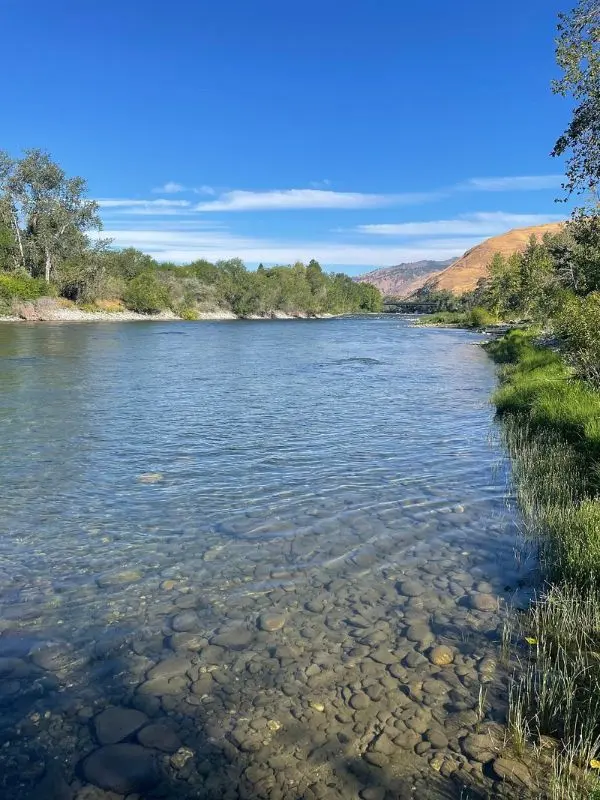 Clear flowing water with rocky edges along Wenatchee River.