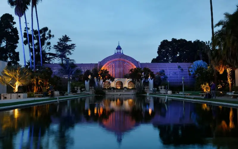 The Botanical Building and pond are illuminated at Balboa Park.