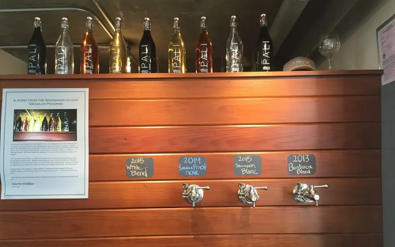 Wine bottles and taps line the counter at Pali Wine Co.