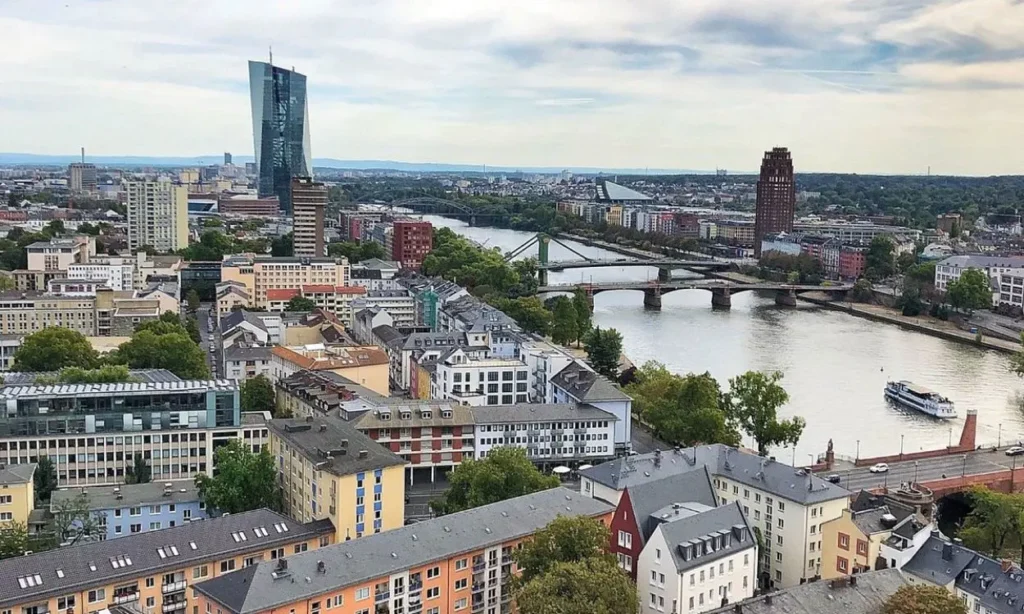 Aerial view of Frankfurt’s skyline and the Main River with bridges crossing through the city.